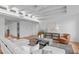 Bright living room featuring hardwood floors, a large sectional couch, and exposed beam ceilings at 312 N Buchanan Blvd # 302, Durham, NC 27701