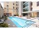 Inviting outdoor pool area with lounge chairs, tables, and chairs at 312 N Buchanan Blvd # 302, Durham, NC 27701