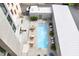 Aerial view of the outdoor pool and lounge area with seating and landscaping at 312 N Buchanan Blvd # 302, Durham, NC 27701