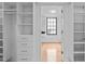 Bright walk-in closet features built-in shelving and drawers, offering ample storage space at 312 N Buchanan Blvd # 302, Durham, NC 27701
