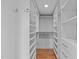 Spacious walk-in closet with extensive shelving and storage, perfect for organization at 312 N Buchanan Blvd # 302, Durham, NC 27701