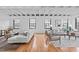 Open concept living room featuring hardwood floors, modern furniture, and lots of natural light at 312 N Buchanan Blvd # 302, Durham, NC 27701