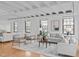 Bright and spacious living room with hardwood floors, large windows, and comfortable seating at 312 N Buchanan Blvd # 302, Durham, NC 27701