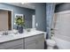 Well-lit bathroom featuring a modern vanity with a double sink at 3412 Pelican Ln, Durham, NC 27703