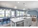 Bright and airy kitchen flowing into the dining and living areas with an open-concept design at 3412 Pelican Ln, Durham, NC 27703