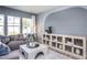 Comfortable living room with a cozy sofa, modern decor, and a large window view at 3412 Pelican Ln, Durham, NC 27703