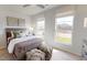 Serene bedroom with hardwood floors, a large bed, and plenty of natural light from windows at 345 Broomside Ave, Raleigh, NC 27603