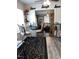 Cozy dining area with a glass table, stylish chairs, and view to living room at 3607 Buffaloe Rd, Raleigh, NC 27604