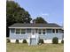 Charming one-story home with blue siding, white trim, and a well-maintained front yard at 3607 Buffaloe Rd, Raleigh, NC 27604