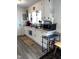 Bright kitchen with white cabinets, granite countertops, and stainless steel appliances at 3607 Buffaloe Rd, Raleigh, NC 27604