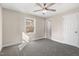 Cozy bedroom with carpet, ceiling fan, natural light from a window, and a neutral color scheme at 3639 Nc Highway 39, Selma, NC 27576