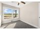 Bedroom featuring neutral paint, new carpet and a large window at 3639 Nc Highway 39, Selma, NC 27576