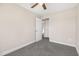 Bedroom featuring neutral paint, carpet, a ceiling fan and an adjoining doorway at 3639 Nc Highway 39, Selma, NC 27576