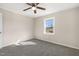 Bedroom featuring wood-look paneling, neutral paint, carpet and a window at 3639 Nc Highway 39, Selma, NC 27576