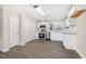 Modern kitchen featuring stainless steel appliances, granite countertops, and white cabinets at 3639 Nc Highway 39, Selma, NC 27576