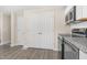 Modern kitchen featuring stainless steel appliances, granite countertops, and white cabinets at 3639 Nc Highway 39, Selma, NC 27576