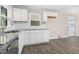 Modern kitchen featuring stainless steel appliances, granite countertops, and white cabinets at 3639 Nc Highway 39, Selma, NC 27576