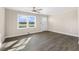 Inviting living room featuring hardwood floors, a ceiling fan, neutral walls, and a bright window at 3639 Nc Highway 39, Selma, NC 27576