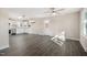 Inviting living room open to the kitchen featuring hardwood floors and neutral walls at 3639 Nc Highway 39, Selma, NC 27576