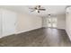 Spacious living room with hardwood floors, recessed lighting, ceiling fans, and double doors to the backyard at 3639 Nc Highway 39, Selma, NC 27576