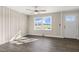 Inviting living room featuring hardwood floors, a ceiling fan, neutral walls, and a bright window at 3639 Nc Highway 39, Selma, NC 27576