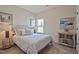 Cozy bedroom with soft lighting, neutral walls, and a window that provides view of the outside at 37 E American Marigold Dr # 35, Benson, NC 27504