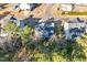 Aerial view shows the house's backyard with a lawn surrounded by the community at 401 River Falls Dr, Apex, NC 27539