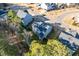 Aerial view of the home's backyard, highlighting a screened porch and well-maintained lawn at 401 River Falls Dr, Apex, NC 27539