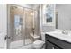 Bathroom with shower and glass doors, white toilet and vanity with white sink at 401 River Falls Dr, Apex, NC 27539