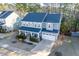 Charming two-story home with a manicured lawn, inviting porch, and attached two car garage at 401 River Falls Dr, Apex, NC 27539