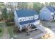 Charming two-story home featuring a well-manicured lawn, attached two-car garage, and inviting front porch at 401 River Falls Dr, Apex, NC 27539
