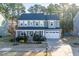 Charming two-story home with a manicured lawn, inviting porch, and attached two car garage at 401 River Falls Dr, Apex, NC 27539