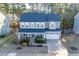 Charming two-story home with a manicured lawn, inviting porch, and attached two car garage at 401 River Falls Dr, Apex, NC 27539