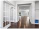 Inviting foyer with rich hardwood floors, a convenient coat nook, and a clear view into the spacious living areas at 401 River Falls Dr, Apex, NC 27539