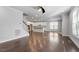 Open-concept kitchen features white cabinets, stainless steel appliances, and a center island at 401 River Falls Dr, Apex, NC 27539