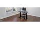 Bright office space with hardwood floors and a view, perfect for a productive work environment at 401 River Falls Dr, Apex, NC 27539