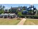 Community pool area with water slide and plenty of lounge chairs for everyone at 401 River Falls Dr, Apex, NC 27539