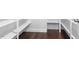 Well-organized walk-in closet with ample shelving, providing efficient storage solutions and functionality at 401 River Falls Dr, Apex, NC 27539