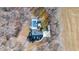 Birds eye view of a secluded house with a pool, surrounded by mature trees and a sprawling yard at 4639 Reid Rd, Elon, NC 27244