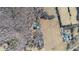 Aerial view of tree-surrounded home with pool and green lawn at 4639 Reid Rd, Elon, NC 27244
