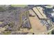 An aerial view shows the property lines for this private home surrounded by mature trees at 4639 Reid Rd, Elon, NC 27244