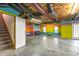 Unfinished basement with concrete floor, painted walls, and overhead duct work at 4639 Reid Rd, Elon, NC 27244