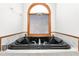 Modern bathroom features a black soaking tub beneath a window at 4639 Reid Rd, Elon, NC 27244