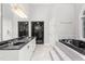 Luxurious bathroom features a soaking tub, walk-in shower, marble countertops and lots of space at 4639 Reid Rd, Elon, NC 27244