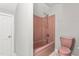 This pink bathroom features a shower and tub combination and matching pink toilet at 4639 Reid Rd, Elon, NC 27244
