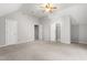 Spacious bedroom with neutral walls and carpet and access to two storage closets and the bathroom at 4639 Reid Rd, Elon, NC 27244