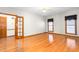Bedroom features hardwood floors, natural light, and access to an ensuite bathroom at 4639 Reid Rd, Elon, NC 27244