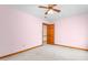 Bedroom with ceiling fan and view to another room at 4639 Reid Rd, Elon, NC 27244