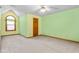 Spacious bedroom with a ceiling fan and a window with an arch at 4639 Reid Rd, Elon, NC 27244