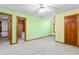 Large bedroom has a ceiling fan, carpet and view to another room at 4639 Reid Rd, Elon, NC 27244